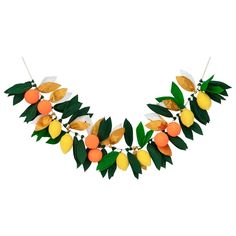 an orange and lemon garland on a white background with green leaves in the shape of fruit