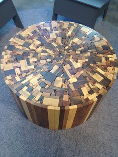 a table made out of wooden pieces on the floor