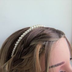 White pearl hair bandThis is a chic and simple pearl hair band, made with luxurious white Swarovski crystal pearls ranging in size from 4mm to 8mm. The pearls are carefully attached to a silver colour band with non-tarnish silver plated wire.The band is approximately 3mm wide, with a circumference of approximately 12cm (4 3/4"), but of course the metal has some bend in it to comfortably fit a range of head sizes. The beaded section covers the centre 22cm (8 3/4") of the band.This simple tiara wo Pearl Hair Band Hairstyles, Pearl Headband Hairstyles, Hair Band Hairstyles, Simple Tiara, Pearl Hair Band, Pearl Hair Accessories, Valentines Hairstyles, Long Hairstyle Ideas, Headband Pearl