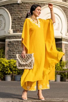 Yellow kaftan style kurta with floral embroidered neckline and flared sleeves. Paired with floral embroidered pant.
Component: 2
Embroidered
Neckline: V neck
Sleeve Length: Three quarter
Fabric: Cotton Slub
Color: Yellow
Flared sleeves - Aza Fashions Embroidered Maxi Length Summer Sets, Summer Straight Kurta Pant Set With Resham Embroidery, Summer Pant Set With Resham Embroidery Straight Kurta, Summer Pant Set With Resham Embroidery And Straight Kurta, Summer Chikankari Embroidery Straight Kurta Pant Set, Anarkali Embroidered Palazzo Set With Tunic, Embroidered Anarkali Tunic Palazzo Set, Spring Palazzo Set With Embroidered Straight Kurta, Summer Palazzo Set With Embroidered Border And Straight Kurta