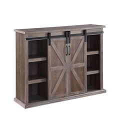 an entertainment center with sliding doors and shelves