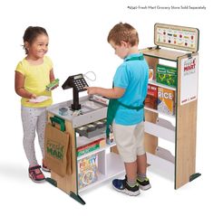 two children playing with a toy cash register