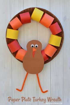 a paper plate turkey wreath made with construction paper