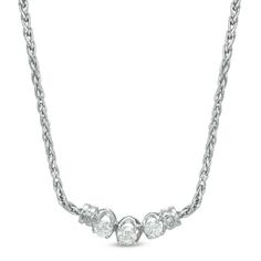 This 1/2 ct. t.w. diamond three stone necklace is set in 14K white gold. The wheat chain measures 16.0 inches in length and secures with a lobster claw clasp. Three Stone Diamond, Local Jewelry, Diamond Stone, Three Stone, Diamond Clarity, White Metal, Jewelry Store, Necklace Designs, Stone Necklace