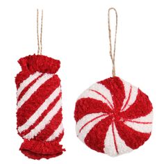 two red and white ornaments hanging from twine