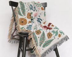 a chair with a blanket on top of it