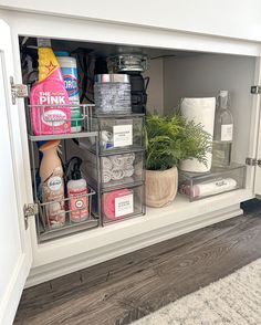 an open cabinet with various items in it