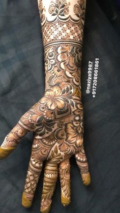 the hand is decorated with intricate designs