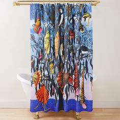 a shower curtain with an image of fish in the water and trees on it's side