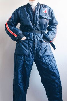 Gear up for the ultimate snow adventure with our Vintage 1970s Quilted Ski Suit! This full-body jumpsuit is not just winter wear; it's a time machine that catapults you straight into the gorpcore vibes of the '70s. Here's your ticket to slope style with a dash of nostalgia. 🏂 Key Features: Quilted Warmth: Embrace the coziness of quilted perfection, keeping you snug and stylish on and off the slopes. Full-Body Fun: Jump into winter wonderland with the convenience of a one-and-done snowsuit. No m Full Body Jumpsuit, Snow Adventure, Winter Gear, Ski Suits, Adventure Gear, Snow Suit, Vintage Vibes, Winter Wear, 1970s