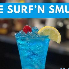 there is a blue drink with ice and a cherry on the rim that says, be sure'n smurf