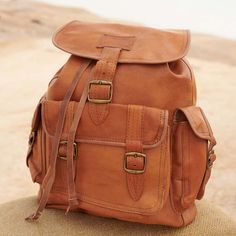 The soft leather backpack is an essential wardrobe accessory. Pack for your commute to work, a weekend away from it all or wild adventures around the world in this shoulder strap backpack for men and women. The medium size and multitude of pockets make this leather backpack ideal for carrying your everyday necessities while providing enough room for overnight essentials.. This stylish brown backpack is handcrafted from 100% vegetable tanned leather for superior resistance to water, abrasions, sp Overnight Essentials, Brown Backpack, Soft Leather Backpack, Brown Backpacks, Brown Leather Backpack, Essential Wardrobe, Wardrobe Accessories, Wild Adventures, Commute To Work