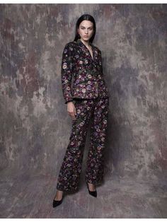 Shine with confidence in these metallic black pants, crafted from poly dupion fabric for a sleek and polished look. Adorned with intricate floral embellishments all over, they add a touch of glamour and sophistication to your ensemble. Elegant Festive Pants With Floral Embroidery, Elegant Floral Embroidered Pants For Festive Occasions, Elegant Floral Embroidered Festive Pants, Floral Print Pants For Party, Floral Embroidery Pants For Spring Party, Elegant Floral Print Pants For Party, Floral Print Party Pants, Floral Embroidered Party Pants For Spring, Spring Party Pants With Floral Embroidery