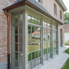 a brick building with many windows on the side