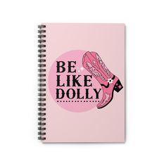 a spiral notebook with the words be like dolly written on it in pink and black