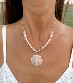 "Glam up your beach wedding or favorite summer dress withthis feminine elegant shell necklace that is perfect for a beach wedding!  It is made with a genuine scallop shellplucked directly from the shores of the Gulf Coast (by yours truly), and it is embellishedwith shell chip beads and freshwater pearl beads.  The necklace is strung on high-quality, durable,natural cream-colored hemp cord and measures 16-18\" in length (with adjustablechain extender).  The center shell measuresapproximately 1\" Cheap Elegant Shell Necklaces, Cheap Shell Necklace For Festival, Cheap Shell Necklace For Festivals, Cheap Shell-shaped Necklaces For Vacation, Luxury Bohemian Shell Necklace For Beach, Cheap Colorful Beaded Shell Necklace As Gift, Pearl Shell Necklace For Vacation, Vacation Pearl Shell Necklace, Bohemian Pearl Shell-shaped Necklace