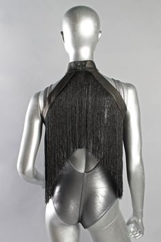 This is one of our favorite pieces from the new collection. It can be worn as a halter top (as seen in the photos) or as shoulder epaulets. Pair it over a bandeau bra, crop top, pasties or nothing! This piece of festival fashion is very fun to dance in Leather collar snaps around the neck. Black poly fringe Can be worn over or under shoulders like a halter (Fits up to size 10 like a halter.) Designed by Five and Diamond Made in Small Batches Black Edgy Halter Top For Festivals, Bra Crop Top, Fringe Festival, Bandeau Bra, Black Fringe, Leather Conditioner, Leather Cleaning, Leather Collar, Small Batches