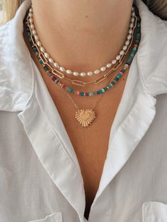 This pearl and gold bead necklace is your new favorite accessory this summer! Layer it with other fun necklaces for a fun and beachy look! Beaded Layering Necklace, Cheap Summer Pearl Necklace With Colorful Beads, Beaded Necklace Layering, Gold Necklace With Pearl Pendant For Summer, Paperclip Necklace Layering, Bohemian Necklace With Pearl Charm For Vacation, Bohemian Pearl Charm Necklace For Vacation, Bohemian Pearl Chain Necklace For Beach, Bohemian Style Pearl Chain Necklace For Beach