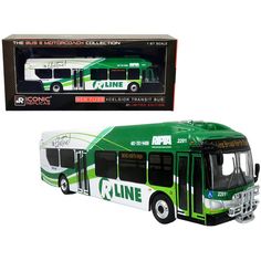 a green and white bus is in front of a black box with the name cline on it