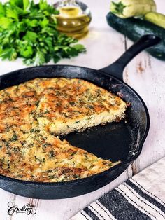 a close up of a pie in a pan on a table with other food items