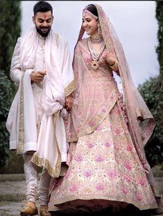 the bride and groom are walking together