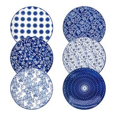 four blue and white plates sitting on top of each other