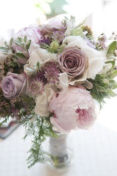 a vase filled with flowers on top of a table