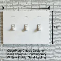 a white wall plate with three light switches attached to it and measurements for each switch