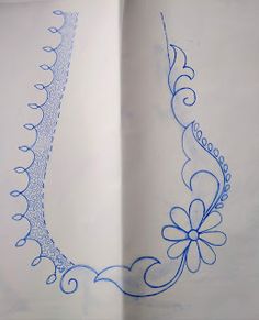 an open book with blue ink on the pages and flowers drawn on it's side