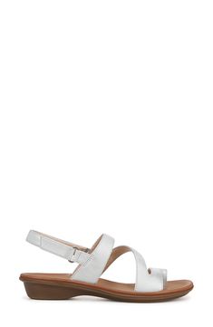 A pillowy footbed is ready to take you comfortably through the day in this asymmetric-strap sandal with an adjustable slingback strap and a flexible sole. 1" heel Synthetic upper/textile lining/synthetic sole Imported Slingback Sandal, Sandal Women, Strap Sandals, Nordstrom Rack, Womens Sandals, The Day, Faux Leather, Size 7, Nordstrom