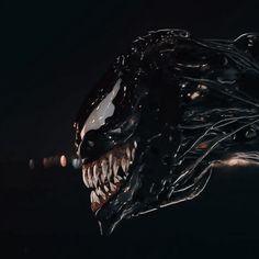 a close up of an alien head with teeth and fangs on it's face