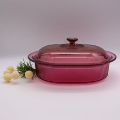 a pink casserole dish and some white balls