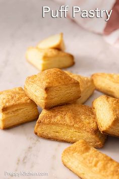 puff pastry cut into pieces on top of a paper towel with the words puff pastry written above it