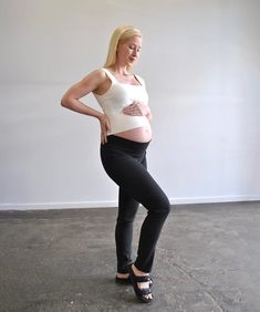 Discover the epitome of versatility and comfort with Around April's Work Straight-Leg Maternity Pants. Crafted from a premium blend of viscose, nylon, and Lycra, these pants are designed to move with you—offering the perfect fit at every stage of your pregnancy. Featuring a full length straight cut leg that looks great in heels or joggers. The unique high-back and low-front cut ensures the waistband stays in place whether you choose to fold it down or up for added support (pictured worn both way Ankle-length Fitted Yoga Pants, Fitted Bump Friendly Bottoms For Pilates, Stretch Straight Leg Pants For Pilates, Fitted Yoga Pants With Tapered Leg, Versatile Fitted Pants For Pilates, Fitted Tapered Leg Yoga Pants, Black Fitted Maternity Bottoms, High Stretch Maternity Yoga Bottoms, Stretch Tapered Leg Bottoms For Yoga