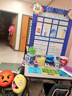 a classroom with an assortment of items on the desk