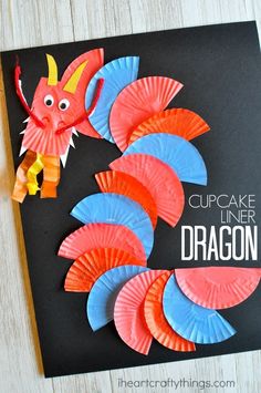 a cupcake liner dragon made out of construction paper