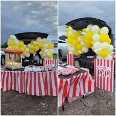 the table is set up with yellow and white balloons in front of an open trunk