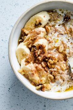 a bowl filled with oatmeal and banana slices