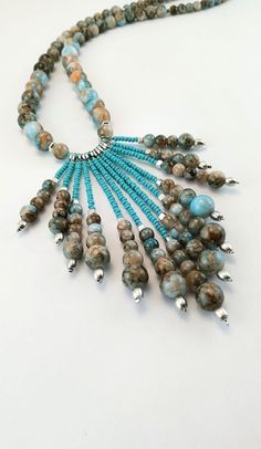 ❤Before completing your purchase, please, read carefully about delivery times for your country and keep in mind that delivery delays may happen due to the pandemic situation and the consequent decrease in the number of flights worldwide. So pretty and stylish jewelry! A delicate long boho necklace beaded with high-quality glass beads, crystals beads, metal beads, and blue tassel embroidered with crystals. It's perfect to compose any look, basic or classic, you can wear it any time. ❤IMPORTANT TO Bohemian Turquoise Necklace With Dangling Beads, Adjustable Turquoise Necklace With Round Beads, Turquoise Beaded Tassel Necklace With Round Beads, Adjustable Turquoise Tassel Necklace With Round Beads, Turquoise Beaded Tassel Necklace, Turquoise Bohemian Tassel Necklace, Bohemian Hand-strung Turquoise Beaded Necklaces, Bohemian Multi-strand Hand-strung Turquoise Necklace, Unique Hand-strung Turquoise Beaded Necklace