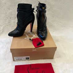 Christian Louboutin Black S.I.T. Rain 100 Nappa Leather Shiny Ankle Boots/Booties. Authentic, Comes With Original Box, New Extra Heel Caps & Dust Bag. Very Elegant & Unique, Gently Used In Excellent Condition High Ankle Boots With Wrapped Heel For Evening, Designer Ankle Heeled Boots With Leather Sole, Designer Ankle Boots With Leather Sole, Designer Ankle Boots For Galas, Designer High Heel Boots With Leather Sole, Designer Closed Toe Boots With Reinforced Heel, Designer Evening Boots With Reinforced Heel, Evening Boots With Wrapped Heel And Round Toe, Designer High Ankle Heeled Boots For Evening