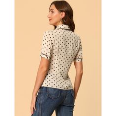 Lovely polka dots and a Peter Pan collar bring casual romance to this shirt, which brings you a vintage look. This elegant and cute blouse, designed with a Peter Pan collar and puff sleeve, adds a touch of elegance and cuteness to your wardrobe. This sweet shirt is easily paired with short skirts or trousers for an elegant and sweet look. Classic Fitted Polka Dot Blouse, Collared Polka Dot Cotton Top, Polka Dot Collared Cotton Top, Polka Dot Cotton Collared Top, Polka Dot Collared Blouse With Button Closure, Classic Fitted Polka Dot Tops, Collared Cotton Polka Dot Tops, Fitted Polka Dot Collared Shirt, Fitted Polka Dot Top With Short Sleeves