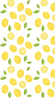 a bunch of lemons with green leaves on them