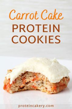 carrot cake protein cookies with cream cheese frosting on top and the words carrot cake protein cookies