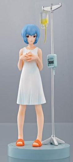 a figurine that is standing next to a scale