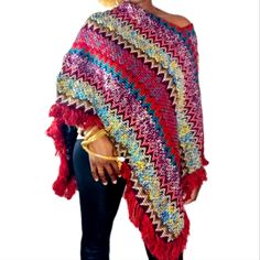 Multi Color Fringe Hem Knit Poncho, Fall Weather Ready, Stay Warm In This Multicolor Tribal Print Poncho Shrug Sweater. One Size Fits Most. Red Long Sleeve Poncho, One Size, Red Bohemian Poncho For Winter, Red Bohemian Knit Sweater, Red Bohemian Sweater For Winter, Bohemian Red Winter Sweater, Red Bohemian Winter Sweater, Red Knitted One Size Sweater, One Size Red Knitted Sweater, Knit Poncho