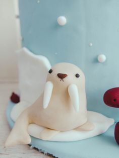 there is a cake shaped like a seal on the table