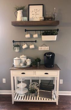 a coffee bar with two shelves above it and some cups on the top shelf next to it