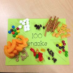 a green board topped with lots of candy and snacks