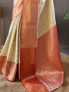 Wear this stunning off-white silk saree with peach color blouse adorned with intricate zari weaving work to make a fashionable statement at any festival, function, or wedding. The saree and unstitched blouse material come in a length of 5.50 meters, allowing you to drape it elegantly to showcase the beautiful zari work.
The off-white color adds a touch of sophistication, while the peach blouse complements the saree perfectly. This glamorous saree include the luxurious silk material that drapes e Peach Color Blouse, Glamorous Saree, Peach Blouse, Color Blouse, Zari Work, Wear Saree, Blouse Material, Traditional Sarees, Peach Color