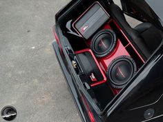 an open car trunk with speakers in it